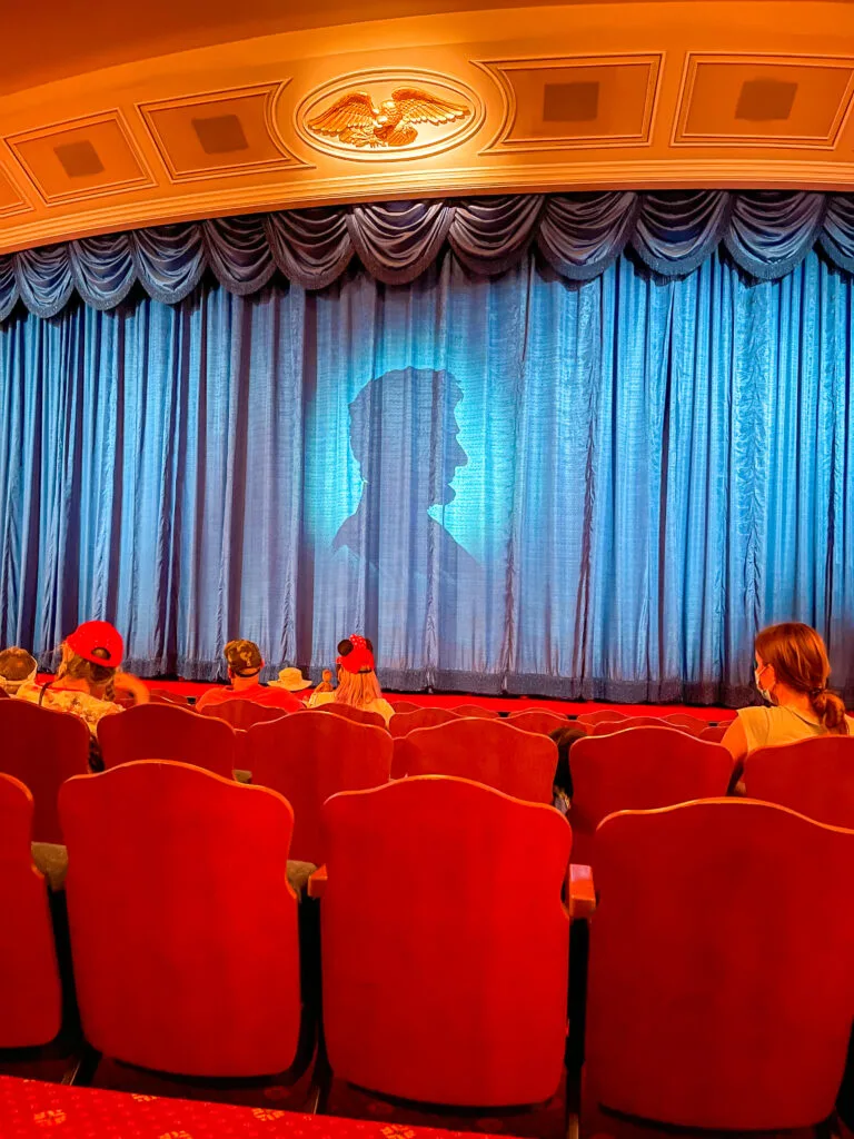 Abraham Lincoln's silhouette on a curtain as part of the Great Moments with Mr. Lincoln show at Disneyland.