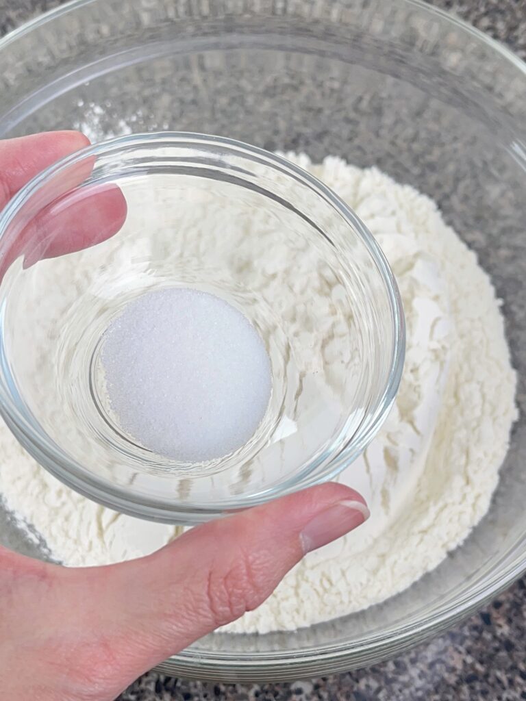 Flour and salt to make sugar cookie bars.