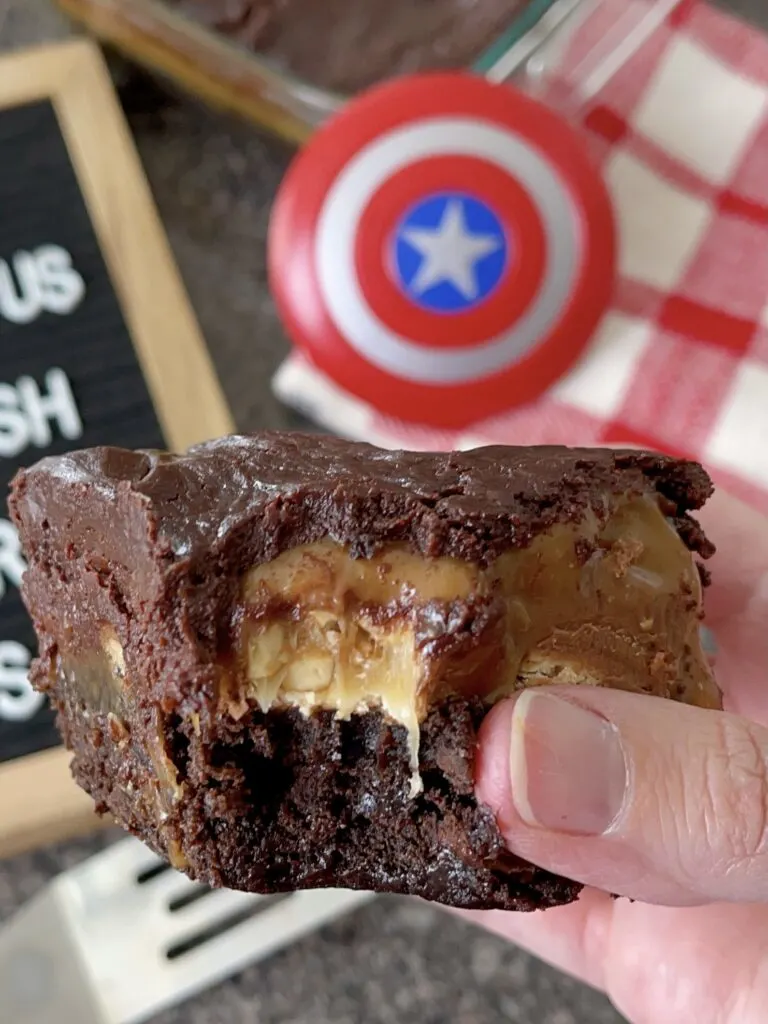 A close up view of the layers in Snickers brownies.