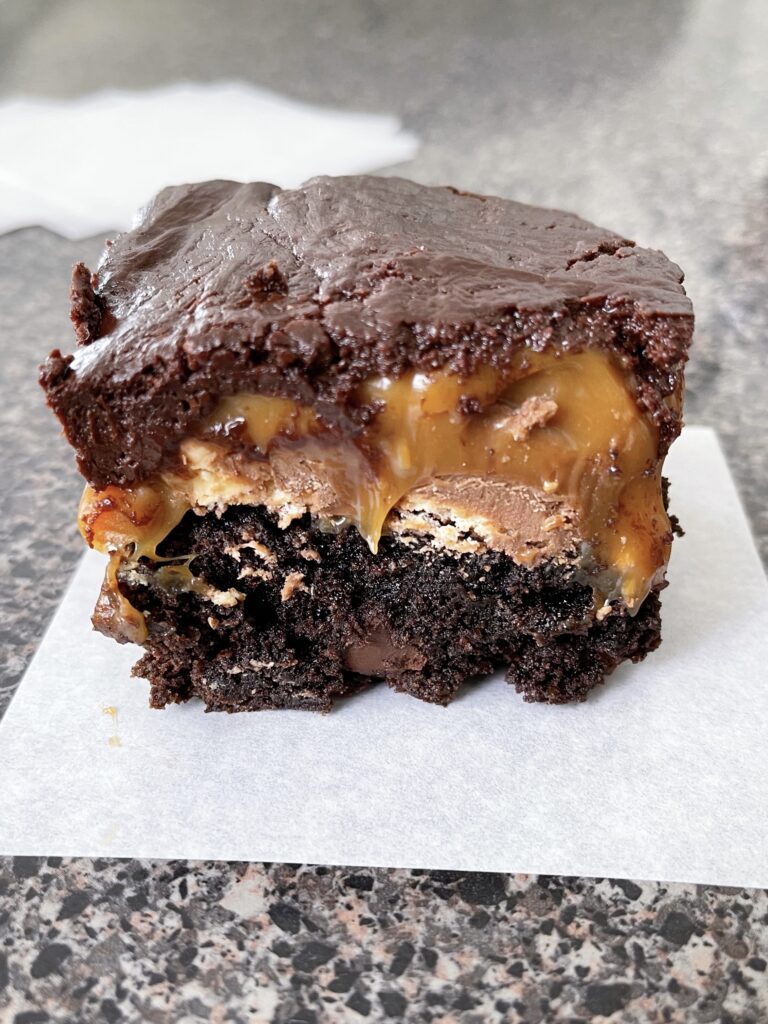 A brownie layered with Snickers bars, melted caramel, and chocolate ganache.
