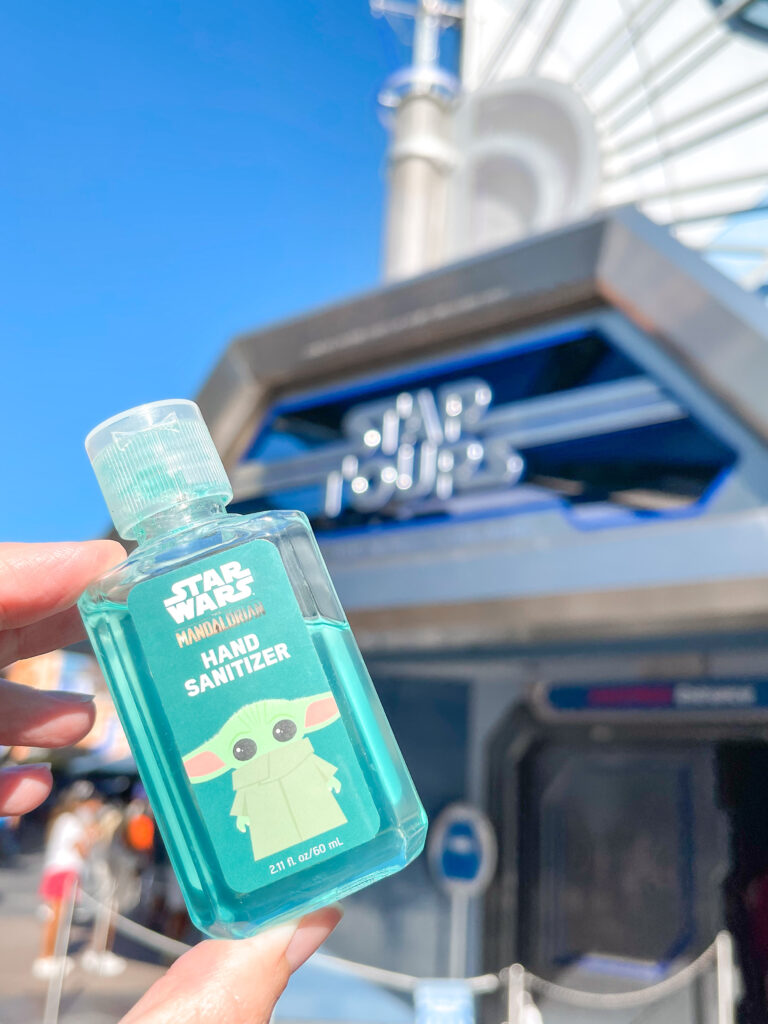 A bottle of hand sanitizer in front of Star Tours at Disneyland in Tomorrowland.