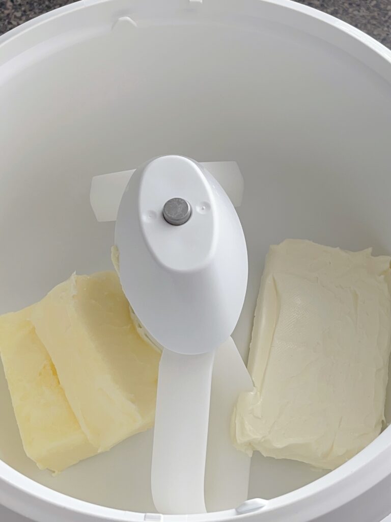 Butter and cream cheese in a stand mixer.