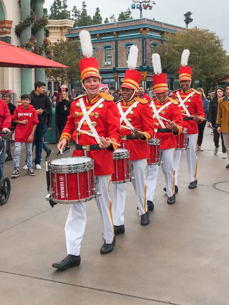 A marching band dressed like toy soldiers at Disneyland.
