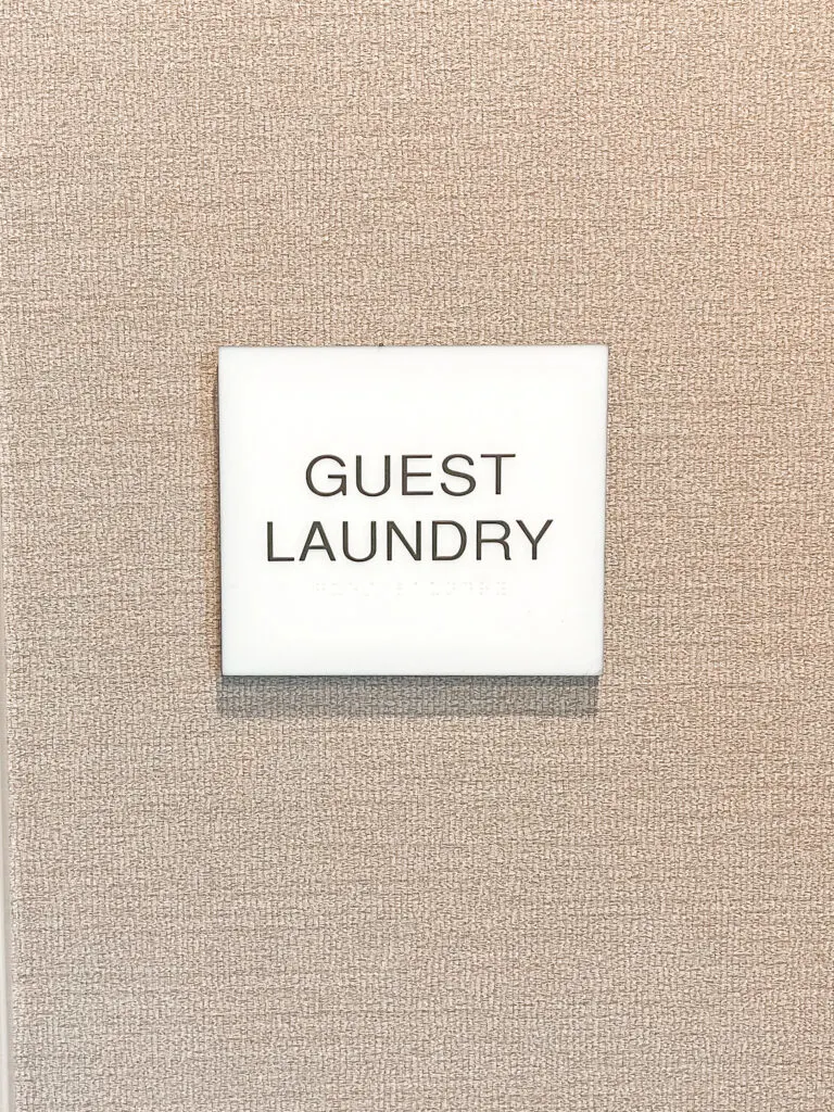 Sign for the laundry room at Cambria Hotel & Suites Anaheim.
