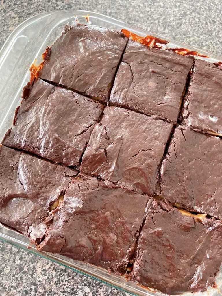 A pan of brownies topped with chocolate ganache.