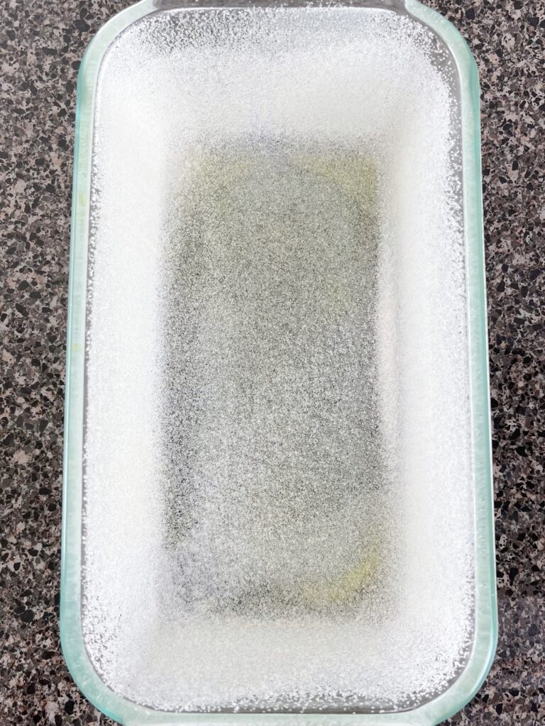 A loaf pan coated with nonstick spray and sugar.