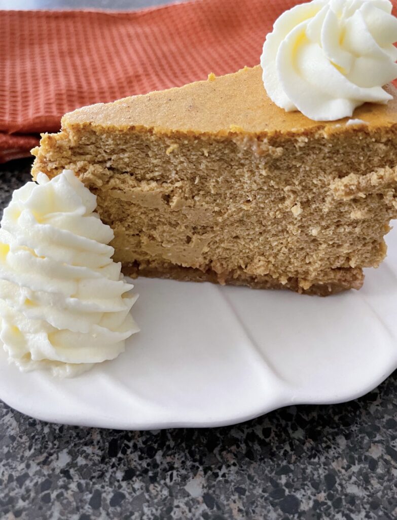 A slice of copycat Cheesecake Factory pumpkin cheesecake.