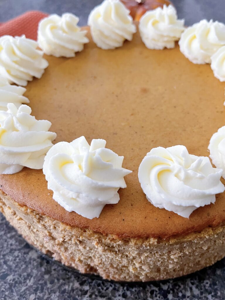 A copycat Cheesecake Factory Cheesecake with white chocolate whipped cream.