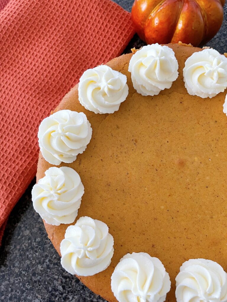 A copycat Cheesecake Factory Cheesecake with white chocolate whipped cream.