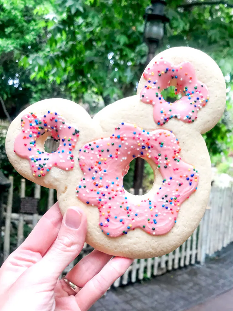 Mickey Mouse shaped sugar cookie that looks like a donut.