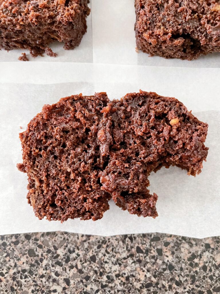 A bite out of a slice of zucchini bread.