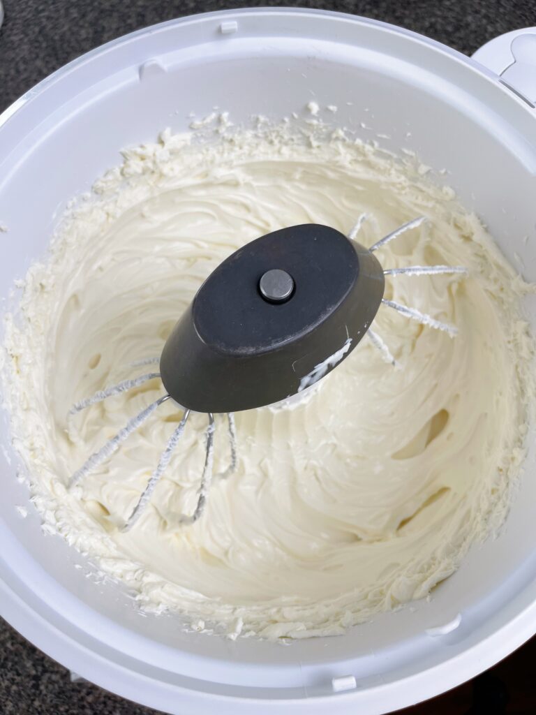 Cheesecake batter in a stand mixer.