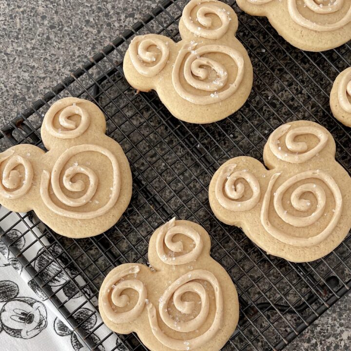 Mickey shaped churro sugar cookies on a cooling rack.