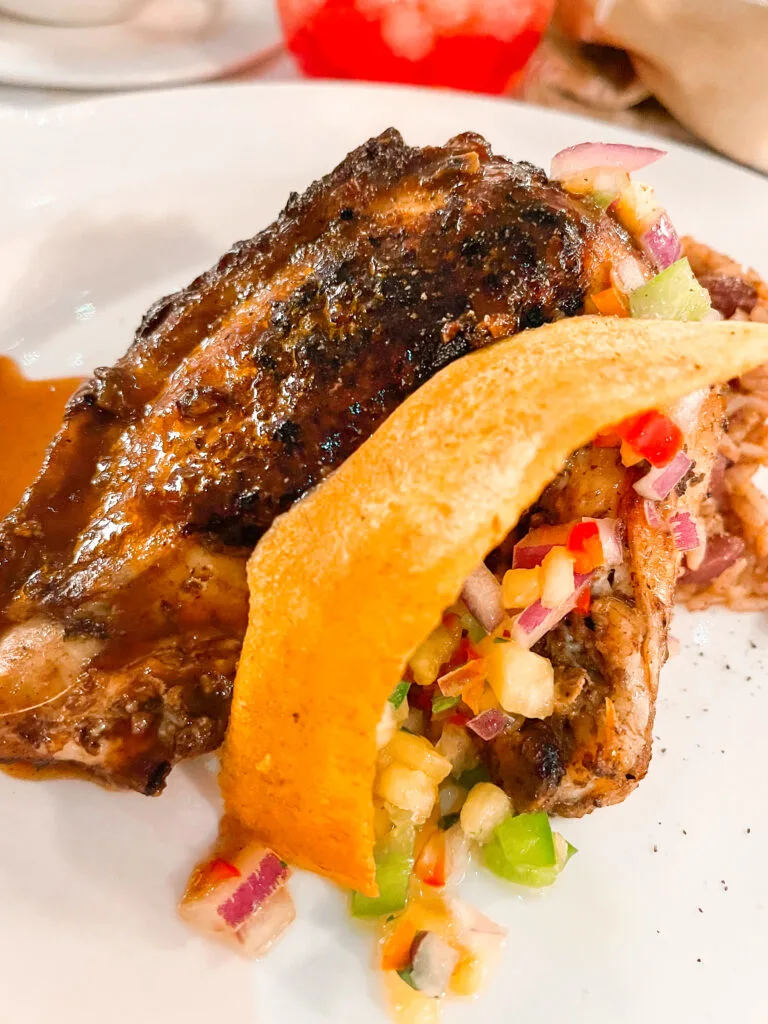 A picture of the Dalma's Jerk Chicken from the Disney Cruise pirate night menu.