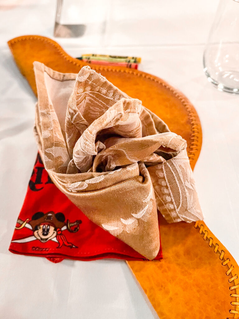 Table setting for Pirate Night on a Disney Cruise.