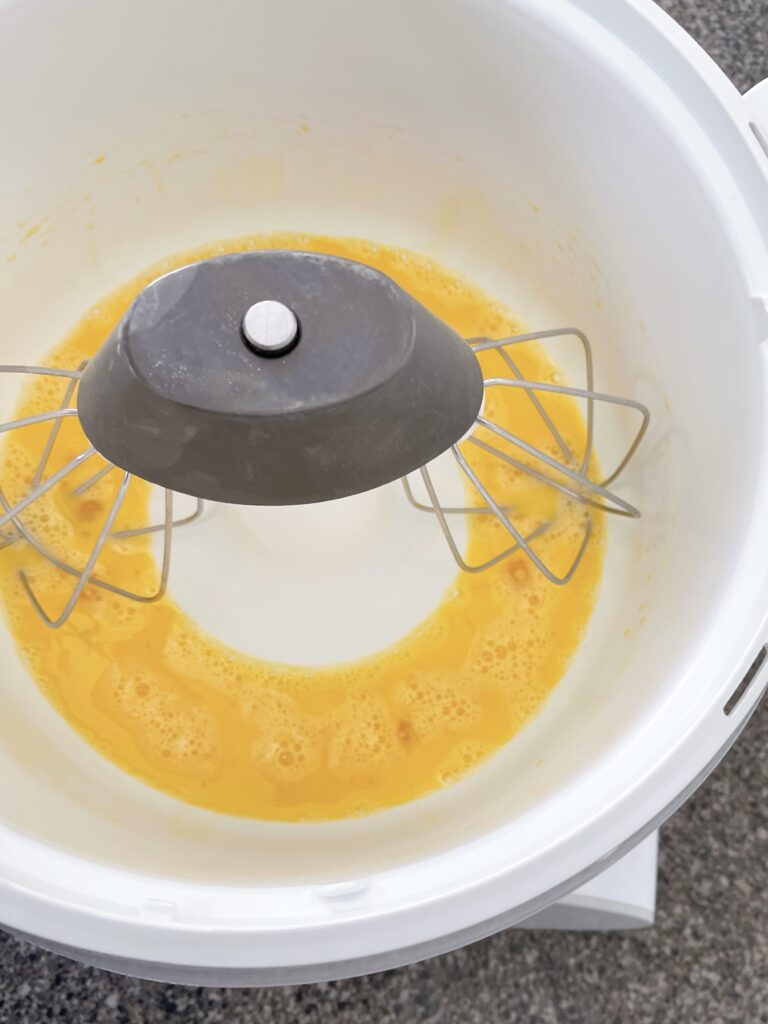 Eggs beaten in a stand mixer.