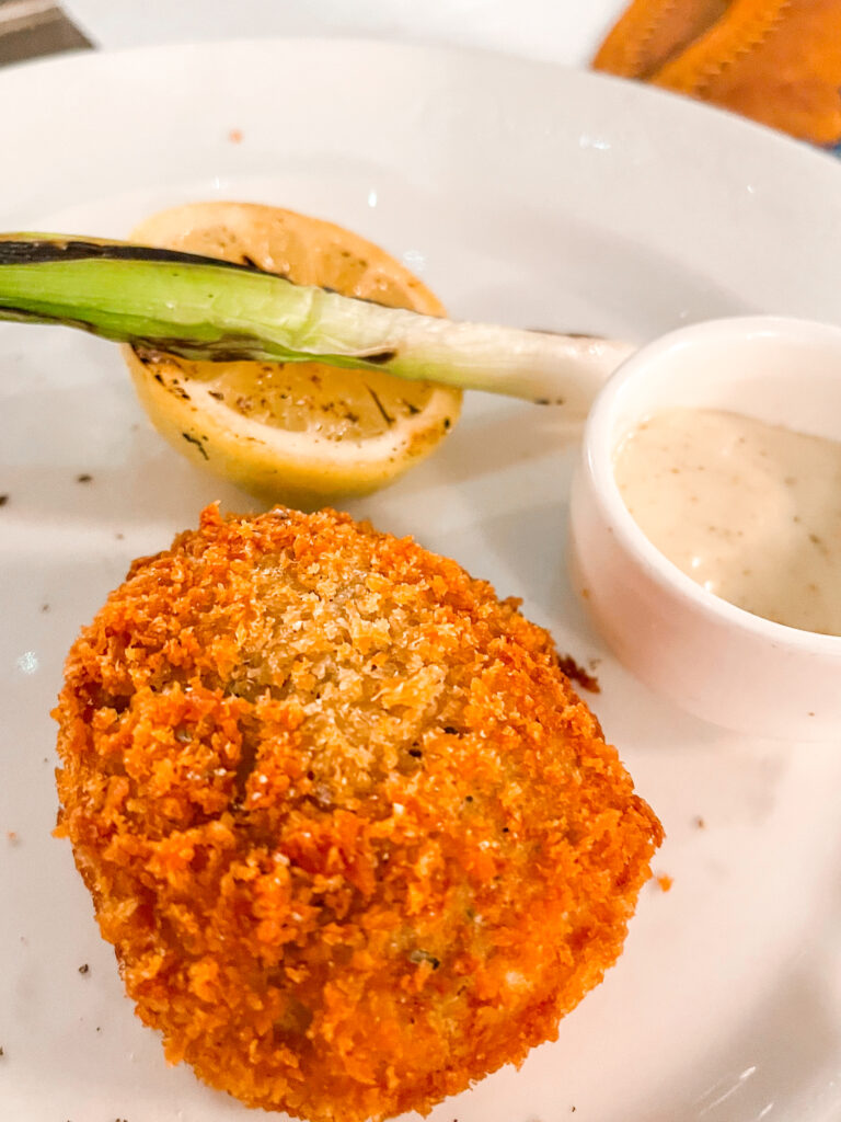A picture of a deep fried Calypso Crab Cake from the Pirate Night Dinner Menu on the Disney Dream.