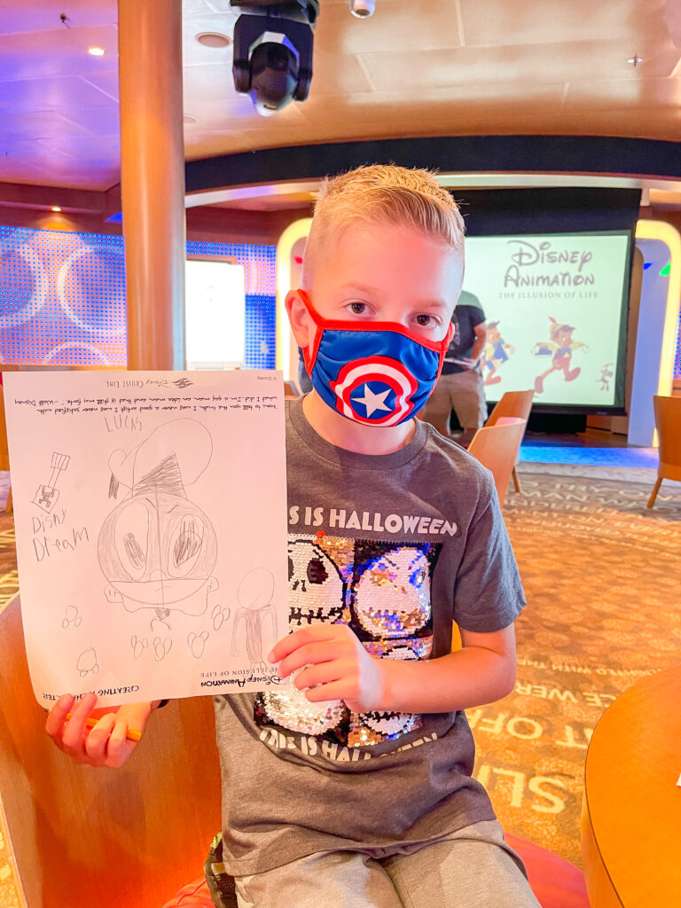 A child and a picture of Donald Duck from a Disney Cruise animation class.