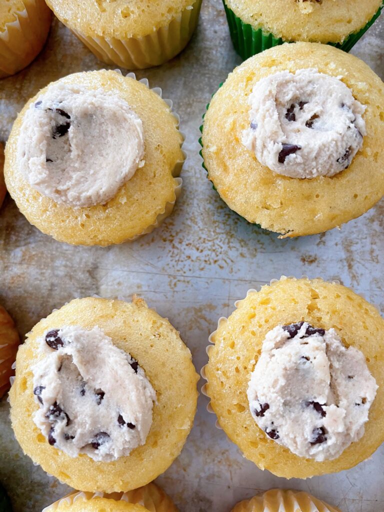 Cookie dough stuffed inside cupcakes.