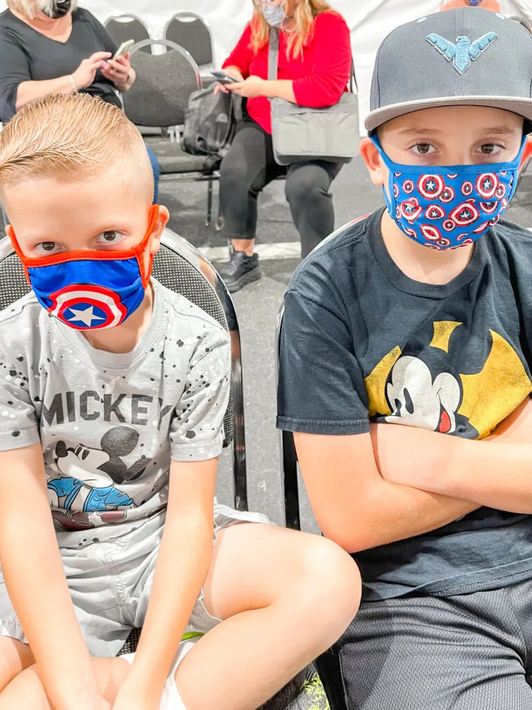 Two kids waiting to be cleared to sail on a Disney Cruise.