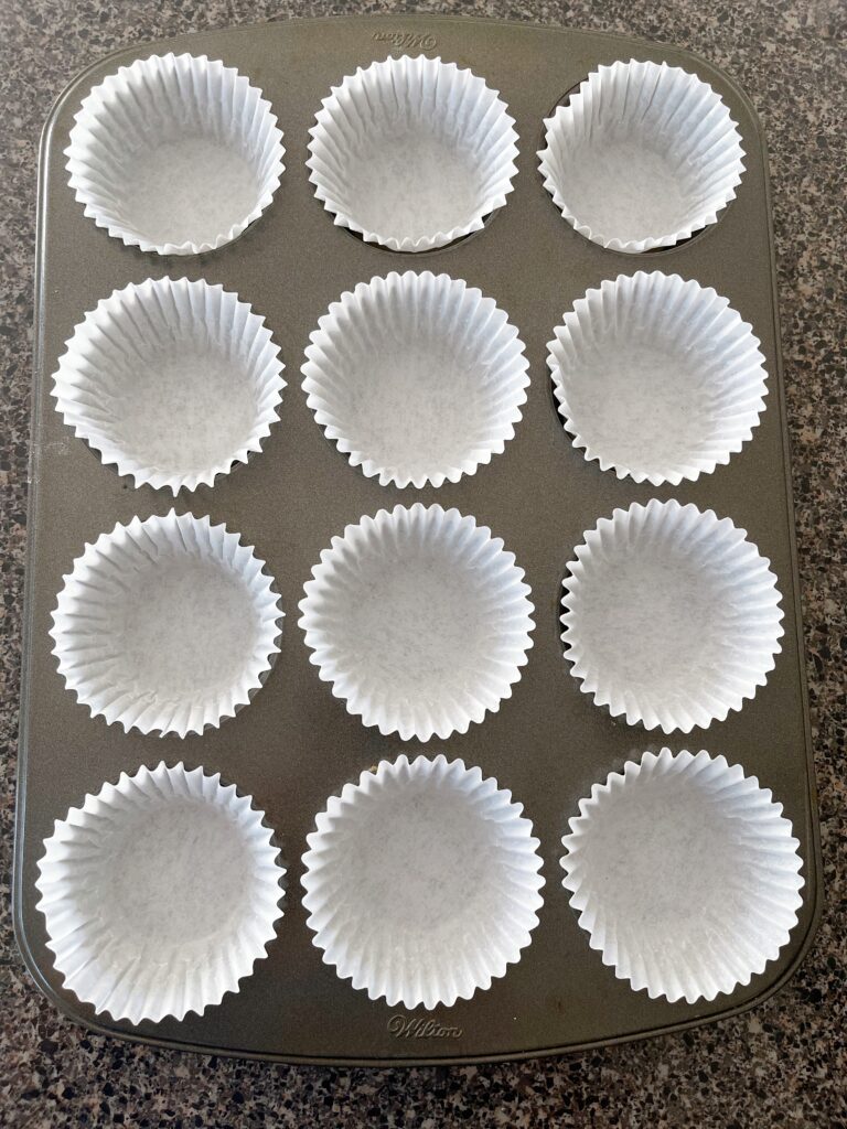 Cupcake liners in a cupcake pan.