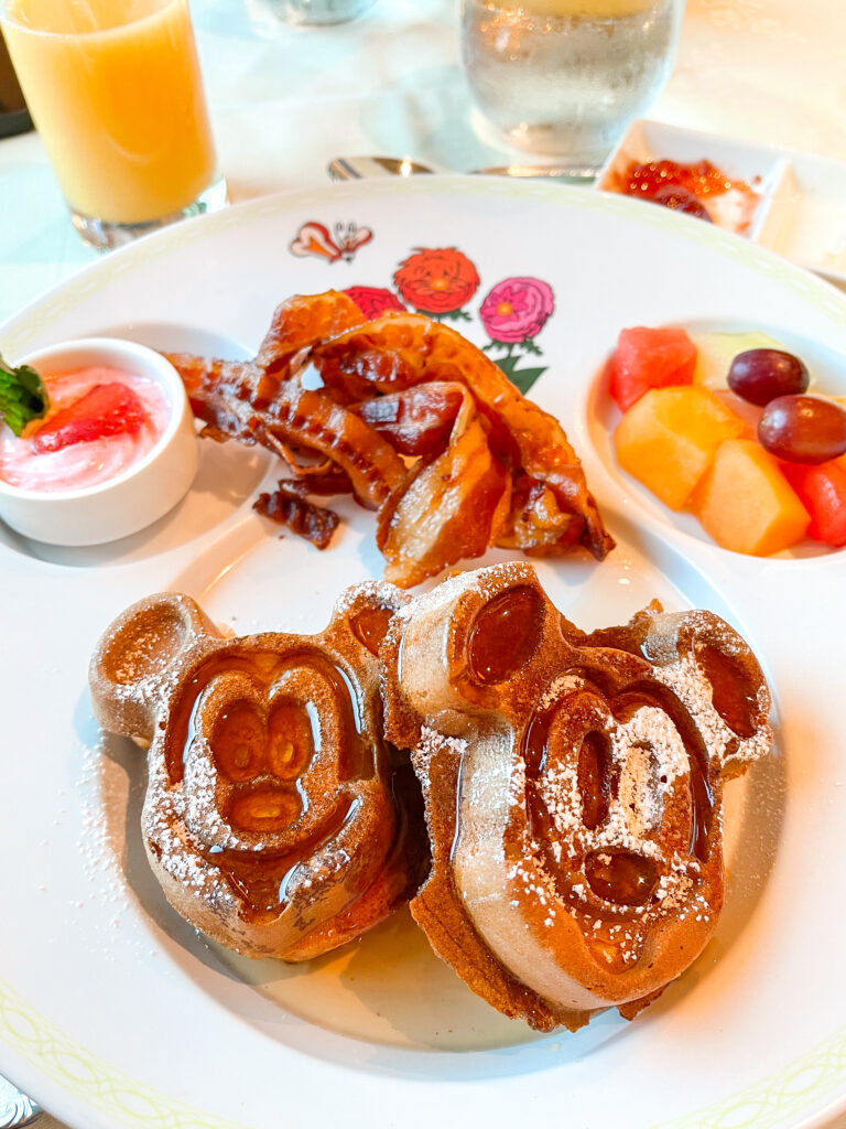 Mickey Waffles, fruit, and bacon from Enchanted Garden on the Disney Dream cruise ship.