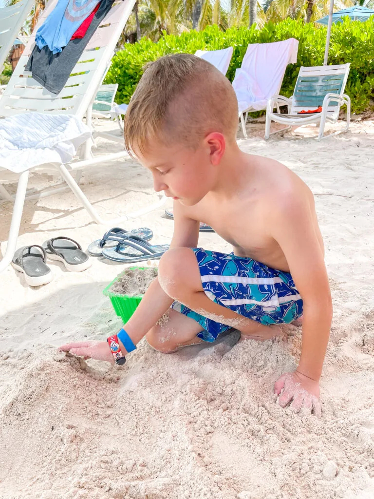 A child playing in the sand on Castaway Cay.