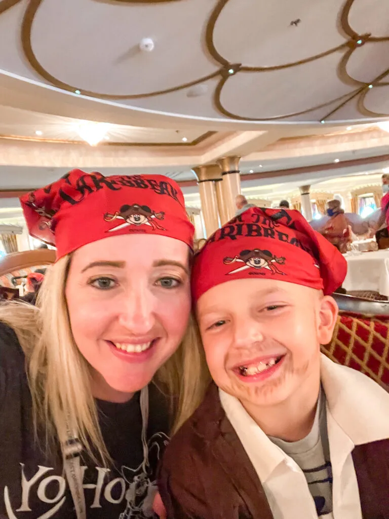 A mom and a son wearing Mickey bandanas on Pirate Night on a Disney Cruise.