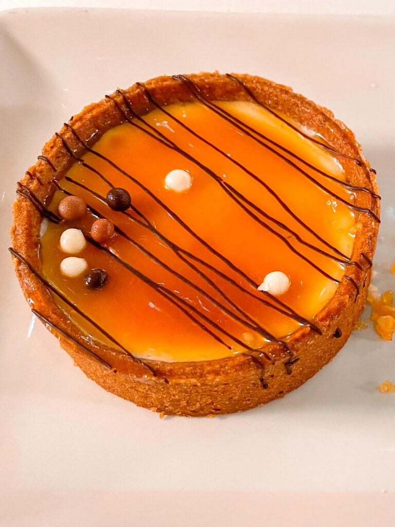 A picture of Caramel Macadamia Nut Cheesecake Tart from Disney Cruise Line's Pirates Night Dinner.