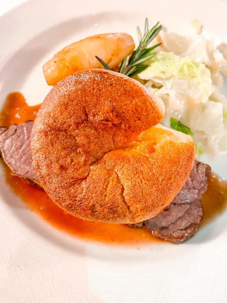 A picture of King George's Roaste Privateer Strip Loin from the Disney Cruise Pirate Night dinner menu.