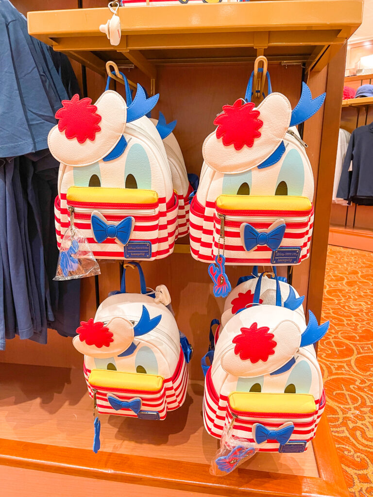 Donald Duck Loungefly backpacks in a Disney Cruise gift shop.
