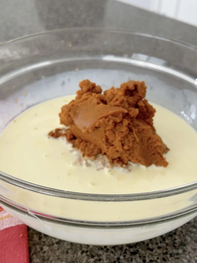 Pumpkin puree and an egg mixture to make pumpkin pie.