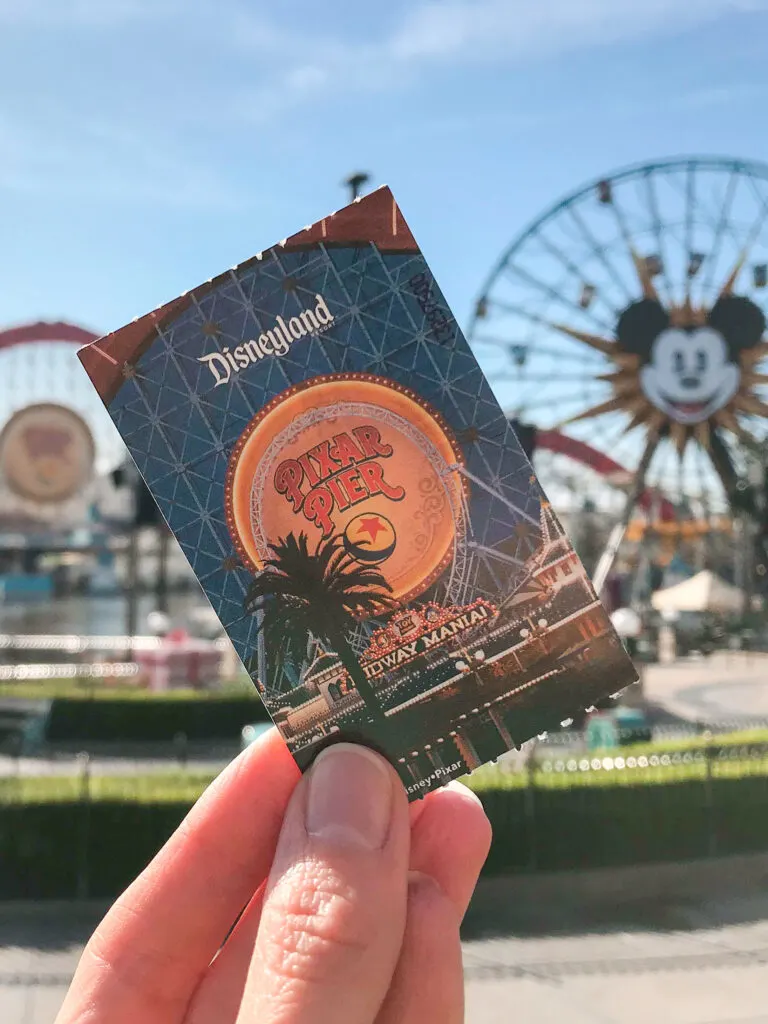 A Disneyland ticket in front of Pixar Pier.