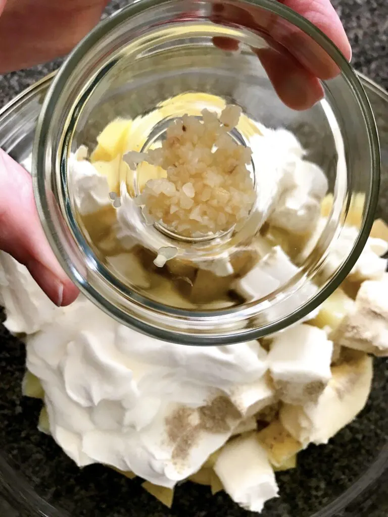 A bowl of minced garlic to add to mashed potatoes.