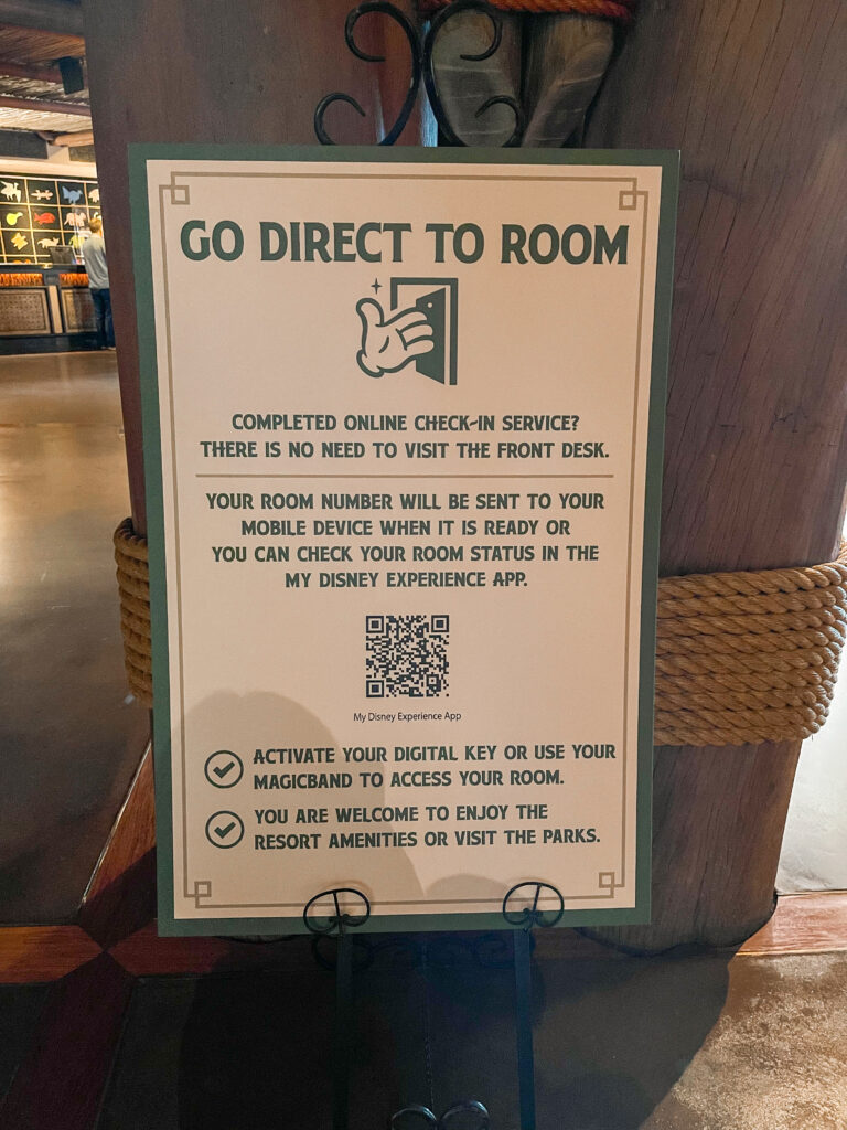 A sign in the lobby of Disney's Animal Kingdom Lodge with instructions on how to check in online.