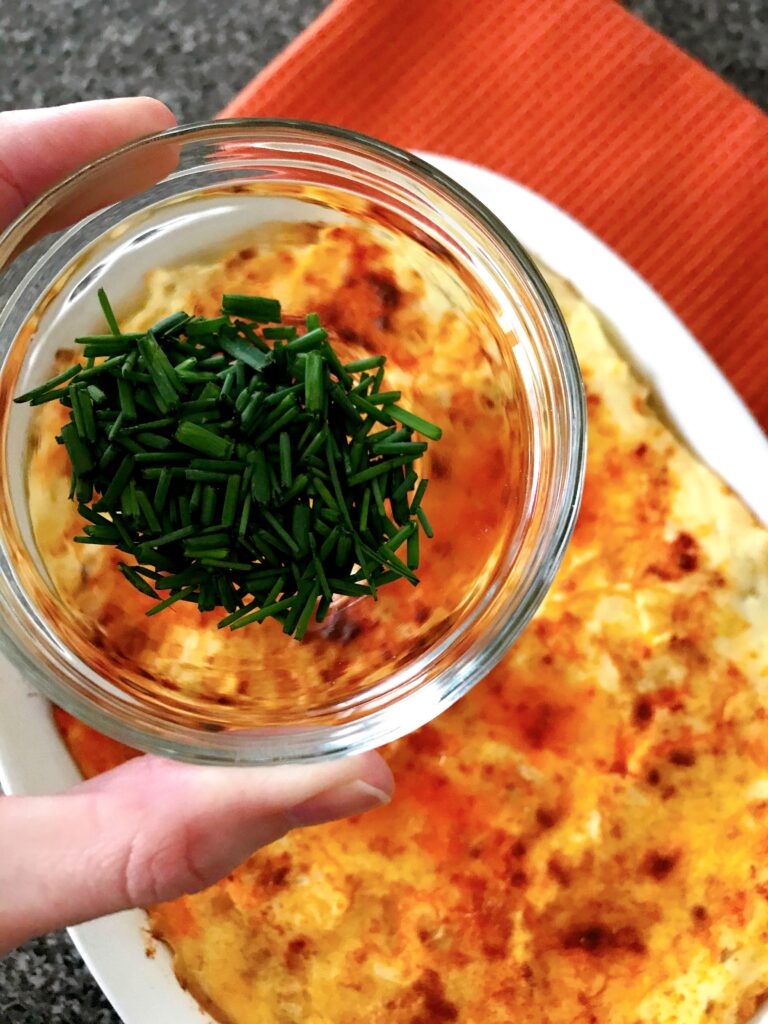 A bowl of chives to garnish mashed potatoes.