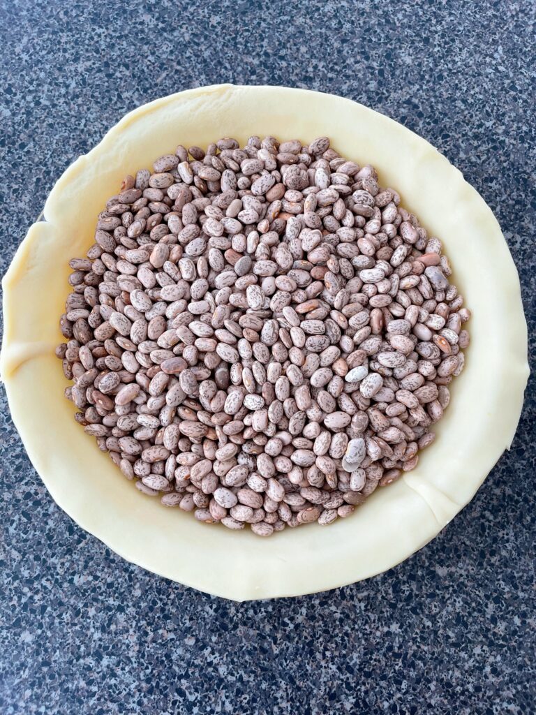 Dried beans used as Pie Weights in a pie crust for Costco Pumpkin Pie
