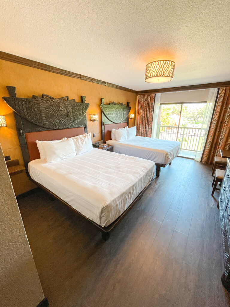 Two Queen beds in a standard room with a savanna view at Disney's Animal Kingdom Lodge.