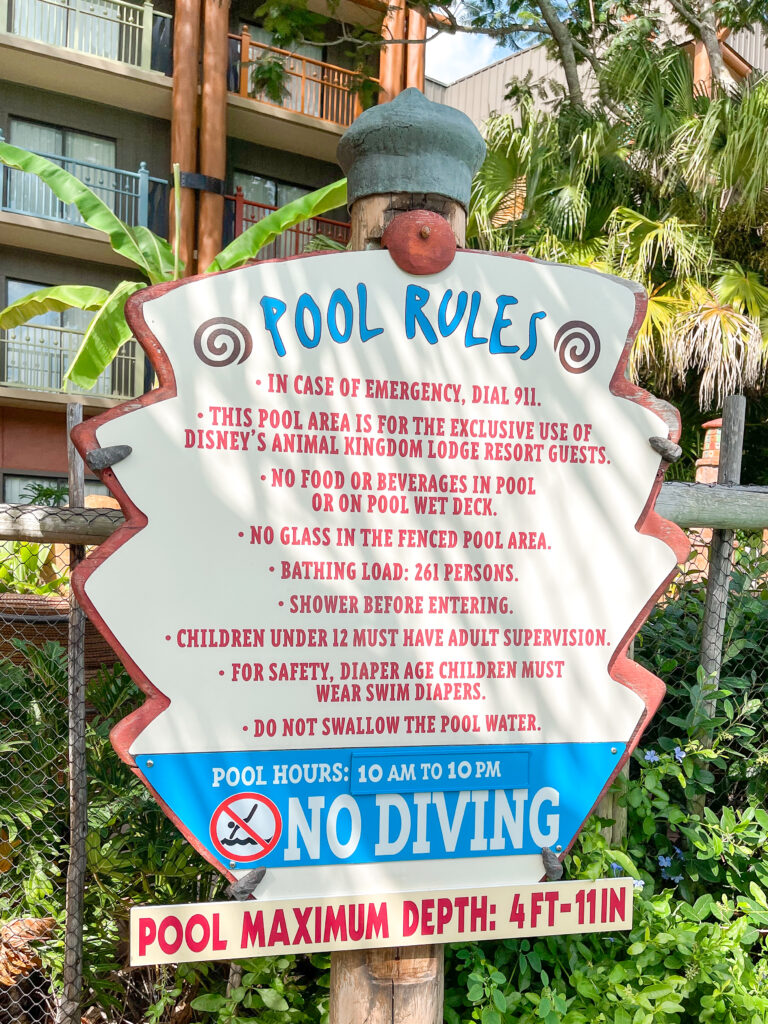 A sign showing pool rules for Disney's Animal Kingdom Lodge.