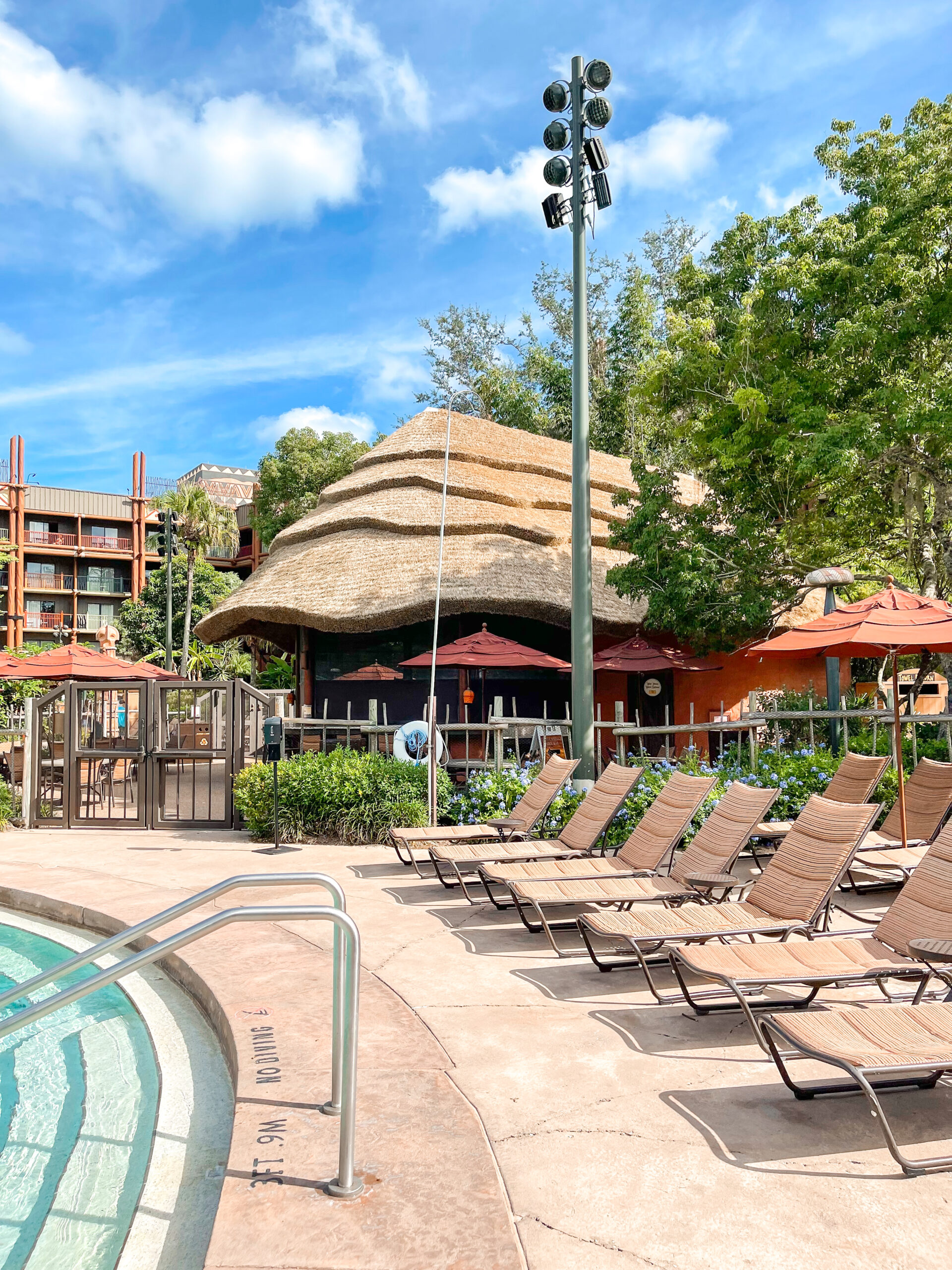 Lounge chairs next to the pool.