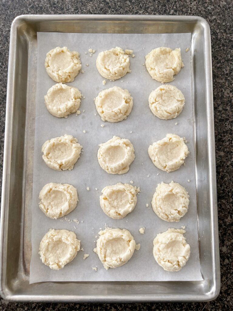 A baking sheet covered with Christmas melt away cookies.