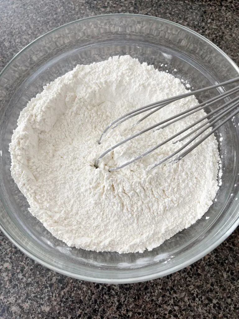 Flour, powdered sugar, and cornstarch in a mixing bowl.