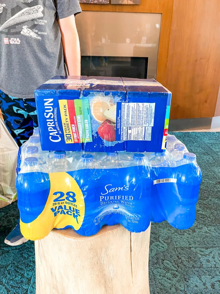 Capri Sun drinks and a case of water ordered from grocery delivery near Disneyland.