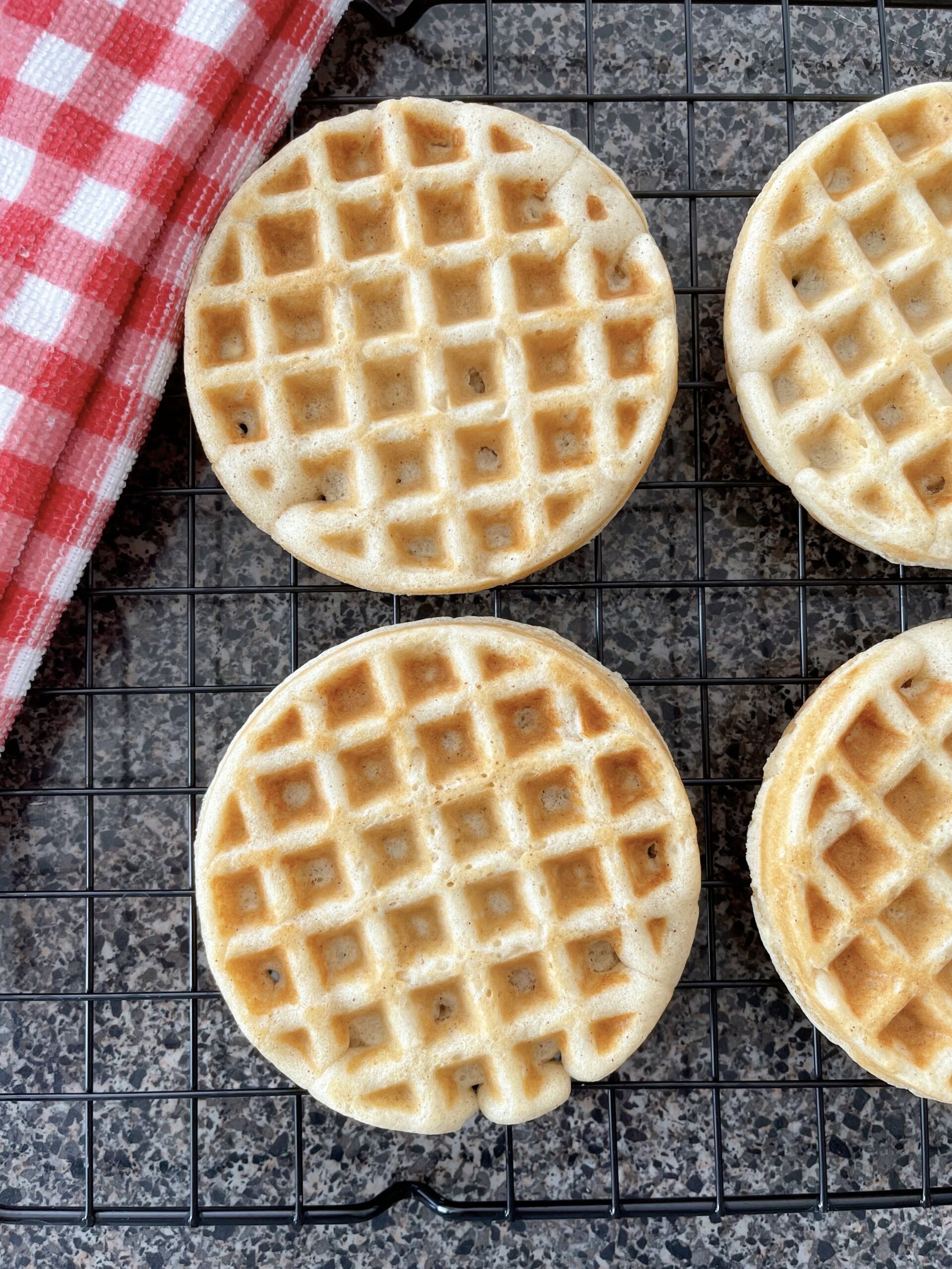 Waffles made with pancake mix on a cooling rack.