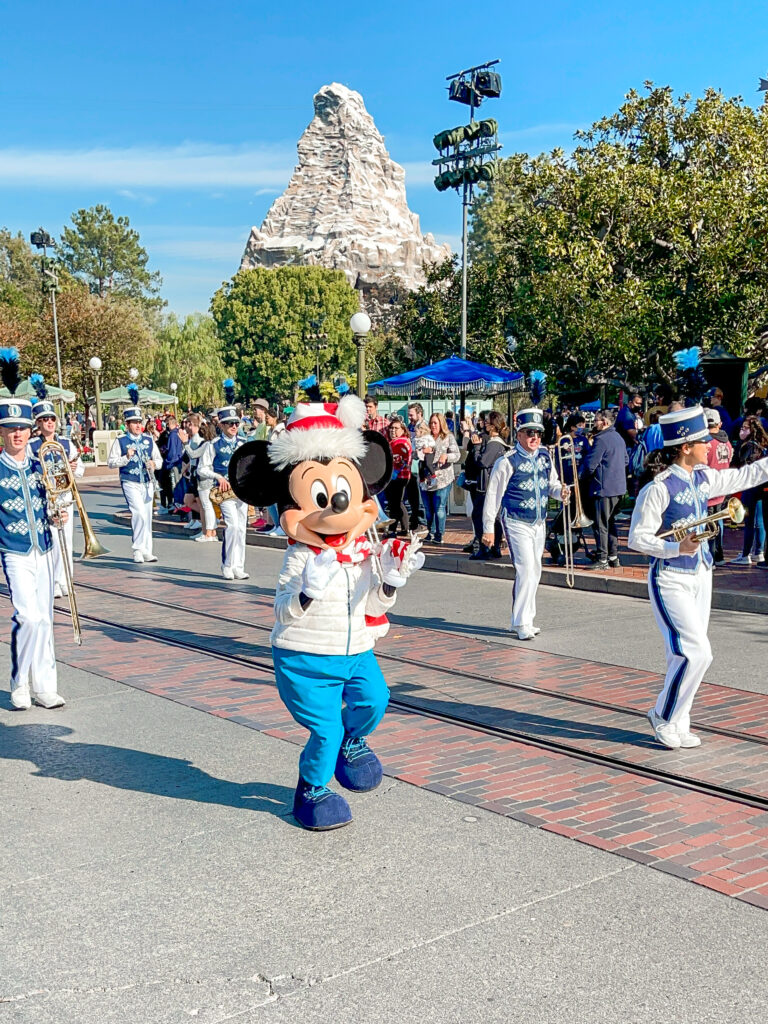 Mickey Mouse leading the Disneyland Band down Main Street USA.