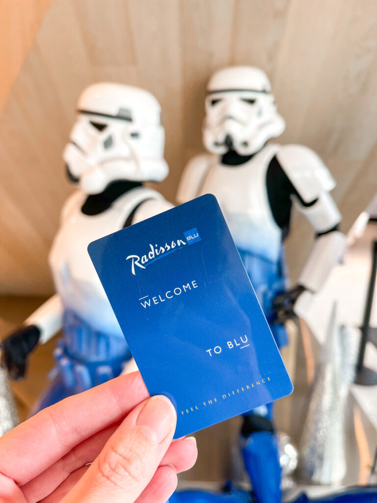 A hotel key from Radisson Blu Anaheim in front of Storm Troopers.