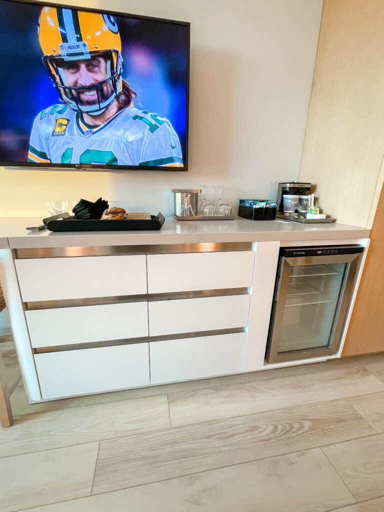 Drawers, a tv, and mini fridge in a guest room at Radisson Blu Anaheim.