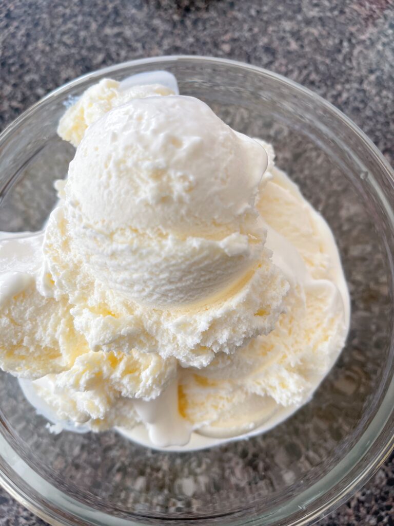 A bowl of vanilla ice cream.