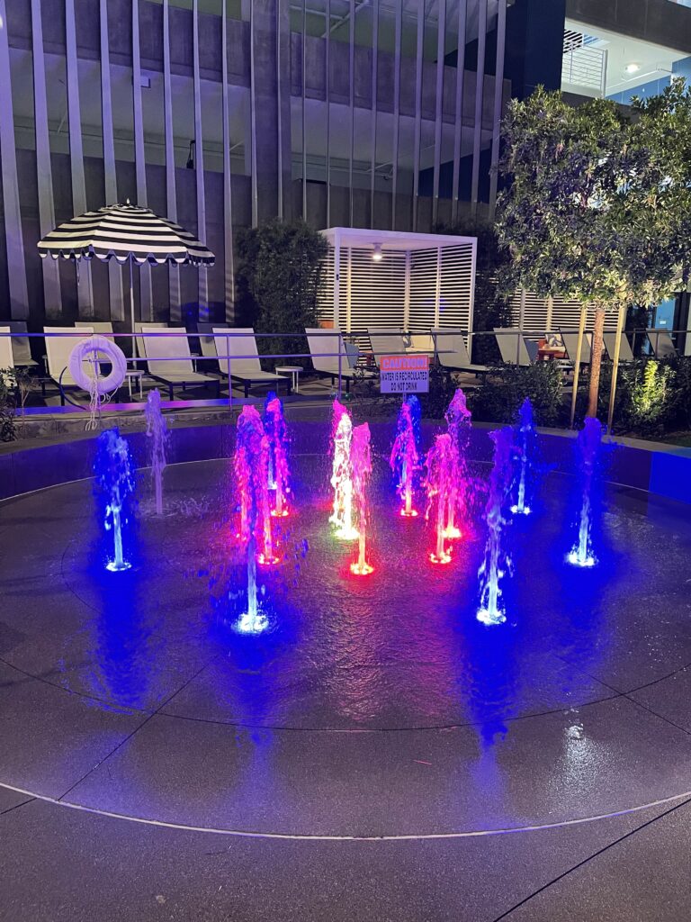 Radisson Blu splash pad at night.