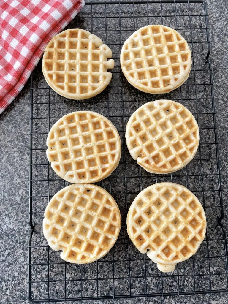 Waffles made with pancake mix on a cooling rack.
